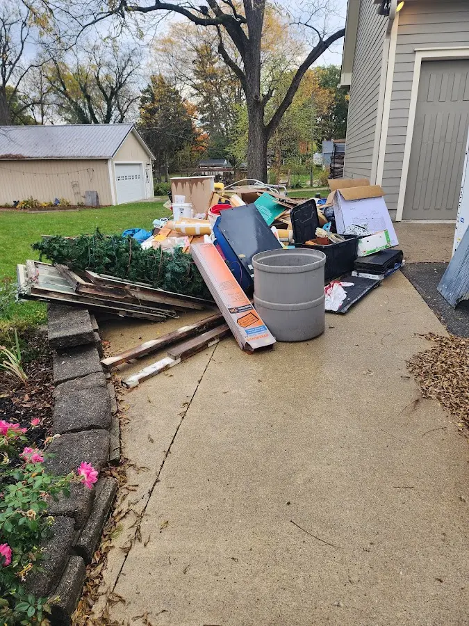 Dumpster being loaded with debris for Commercial Dumpster Rental in Columbus